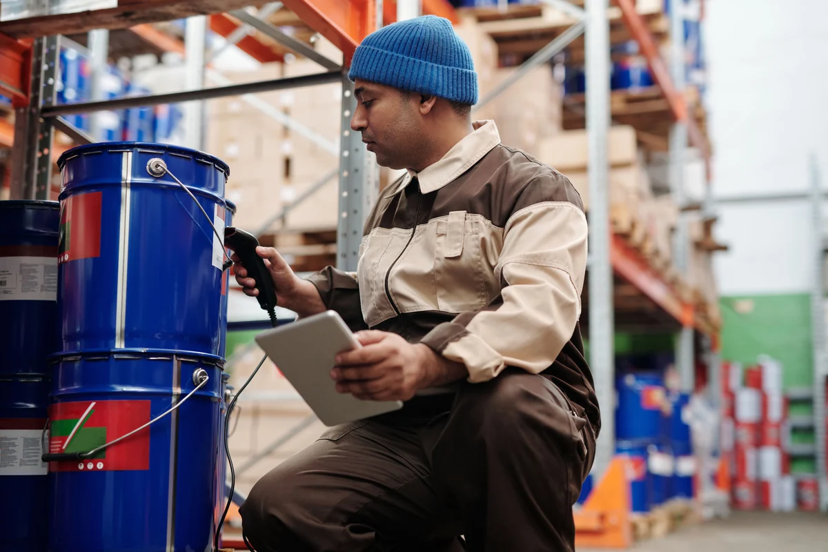 Warehouse worker scanning goods with a handheld device